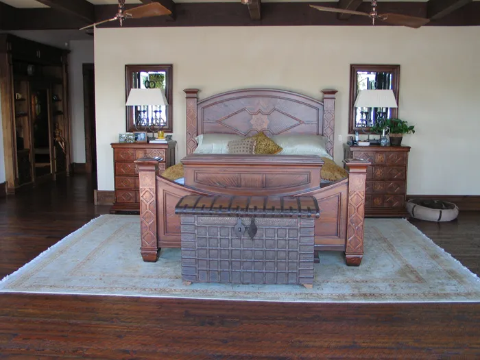 Matching custom bedroom set with carved headboards and dressers