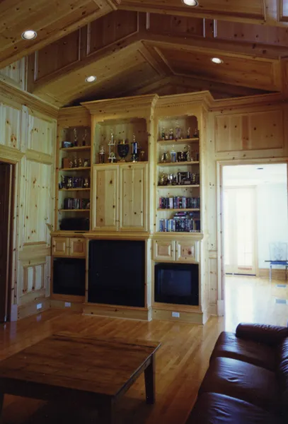 Corner built-in entertainment center in a vaulted great room