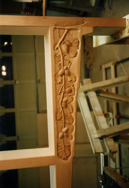 Hand-carved decorative bracket on a custom staircase