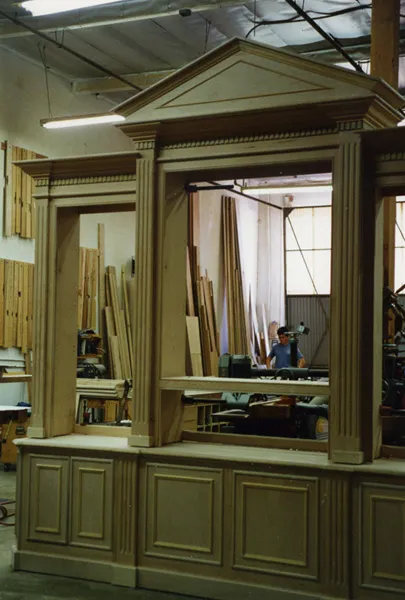 Custom paneled cabinetry being finished in the workshop