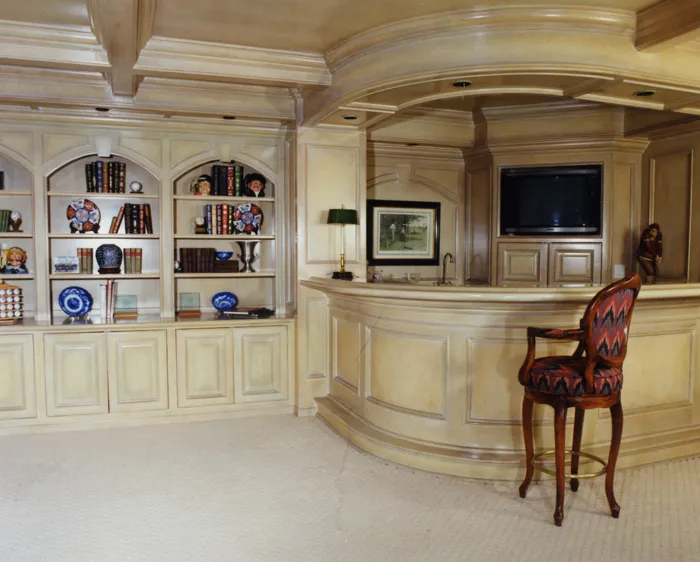 Traditional custom kitchen with a curved island and floor-to-ceiling alder cabinetry